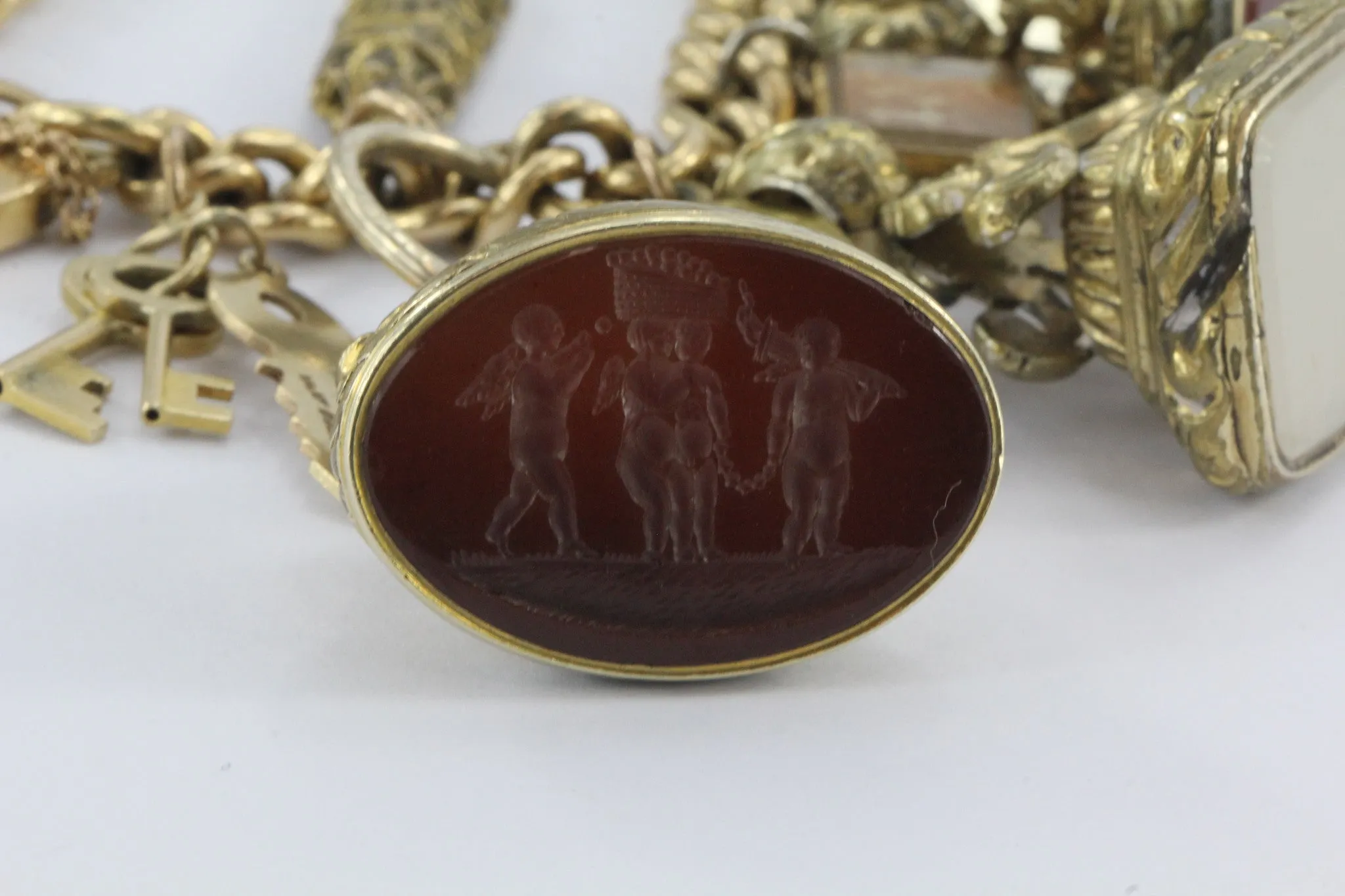 Antique 18K Gold English Tassie Seal heavy Loaded Charm Bracelet