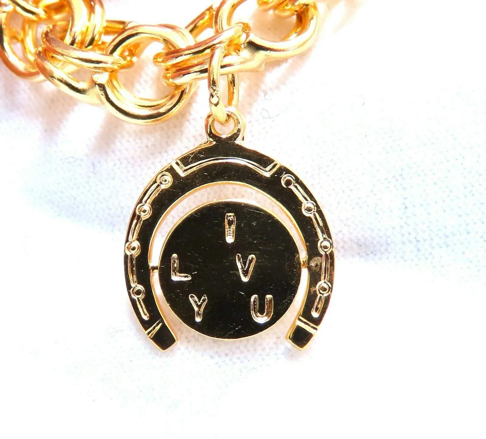 Eight Charms Link Bracelet 14kt gold 7 inch 43gm