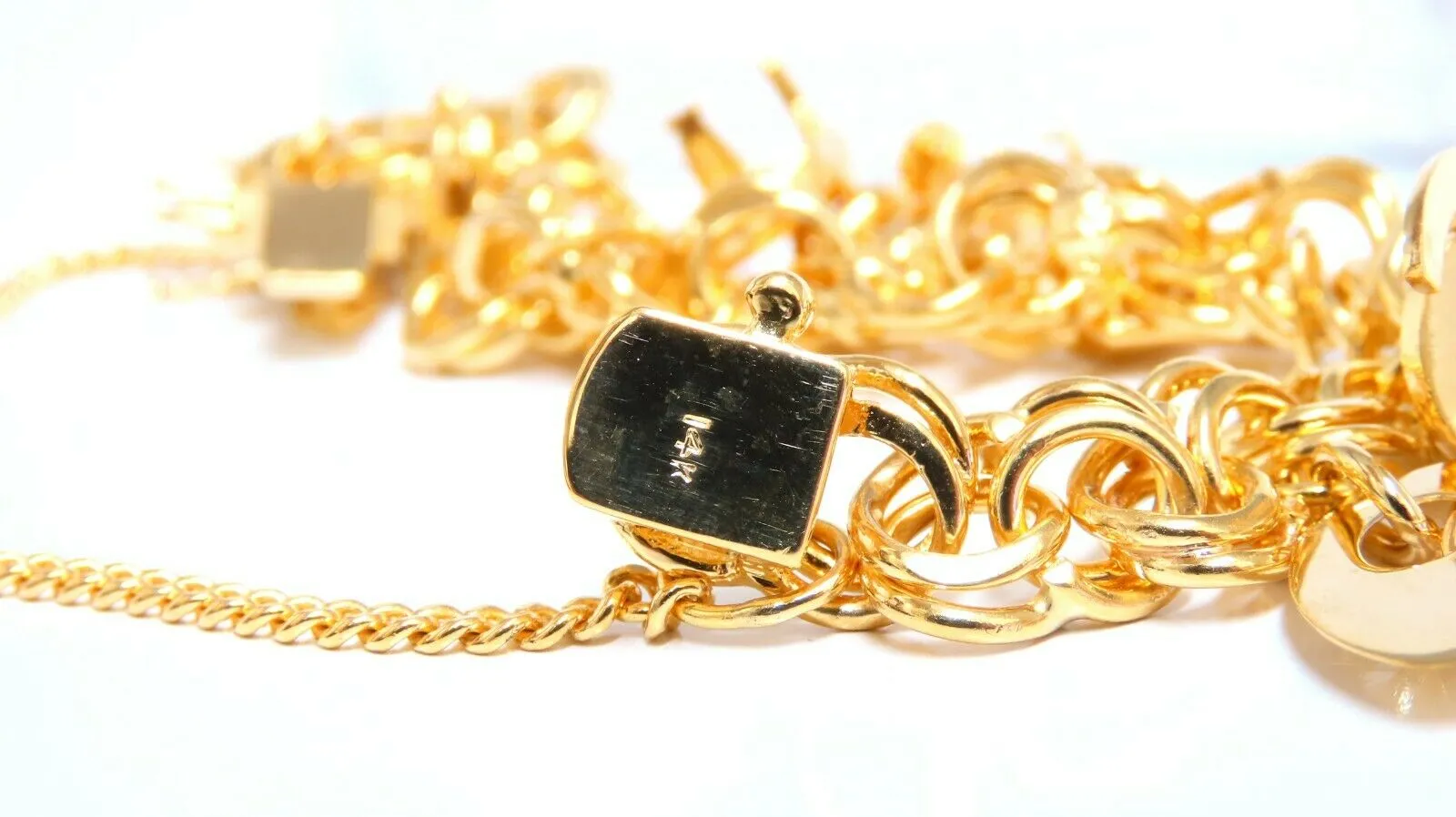 Eight Charms Link Bracelet 14kt gold 7 inch 43gm