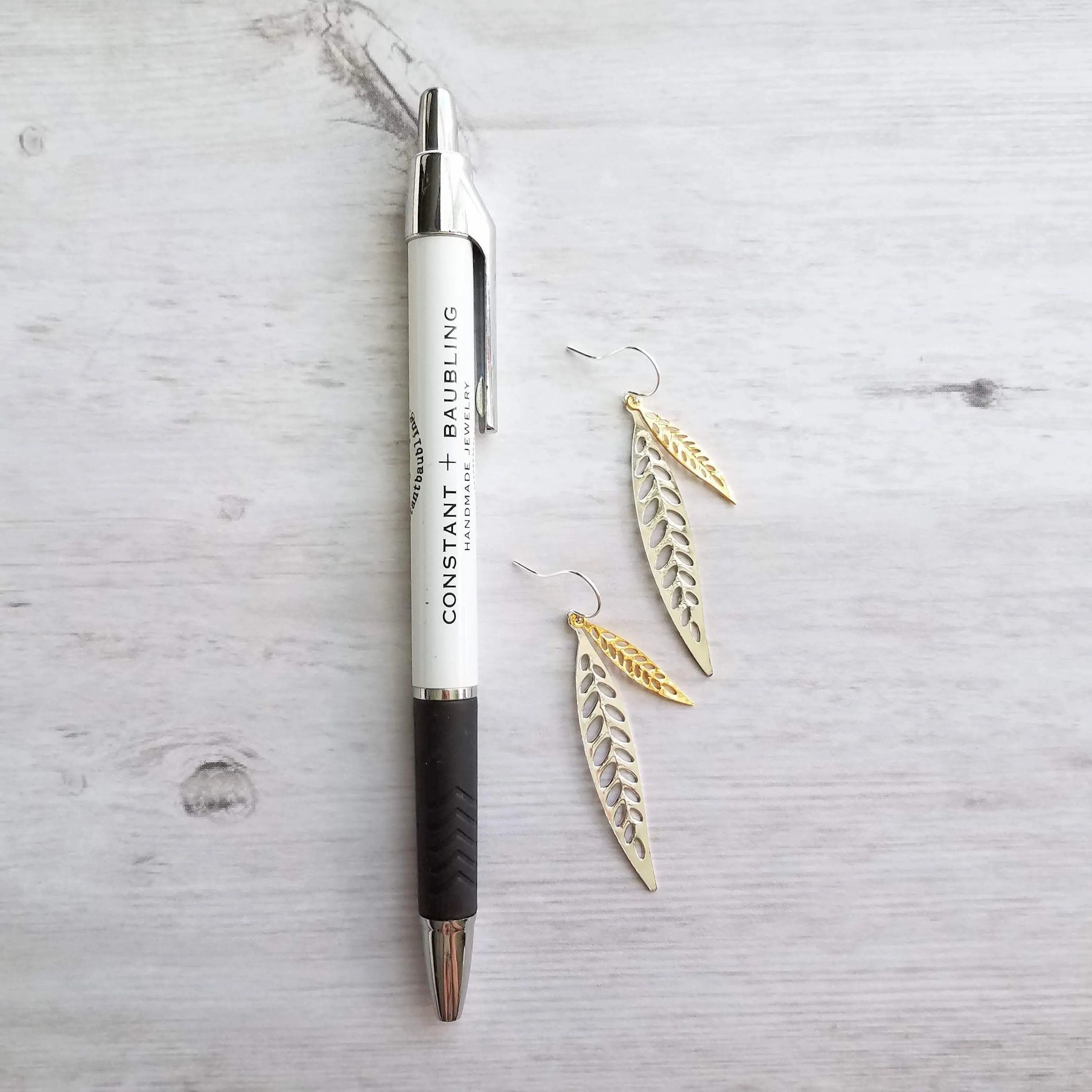 Silver Gold Leaf Earrings, long narrow leaf earrings, silver leaves, filigree leaf earring, silver leaf earring, cut out leaf earring, thin