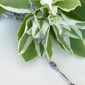 Silver Single Wave Oval Cut Tanzanite and Petite Silver Topaz Highlight Bracelet