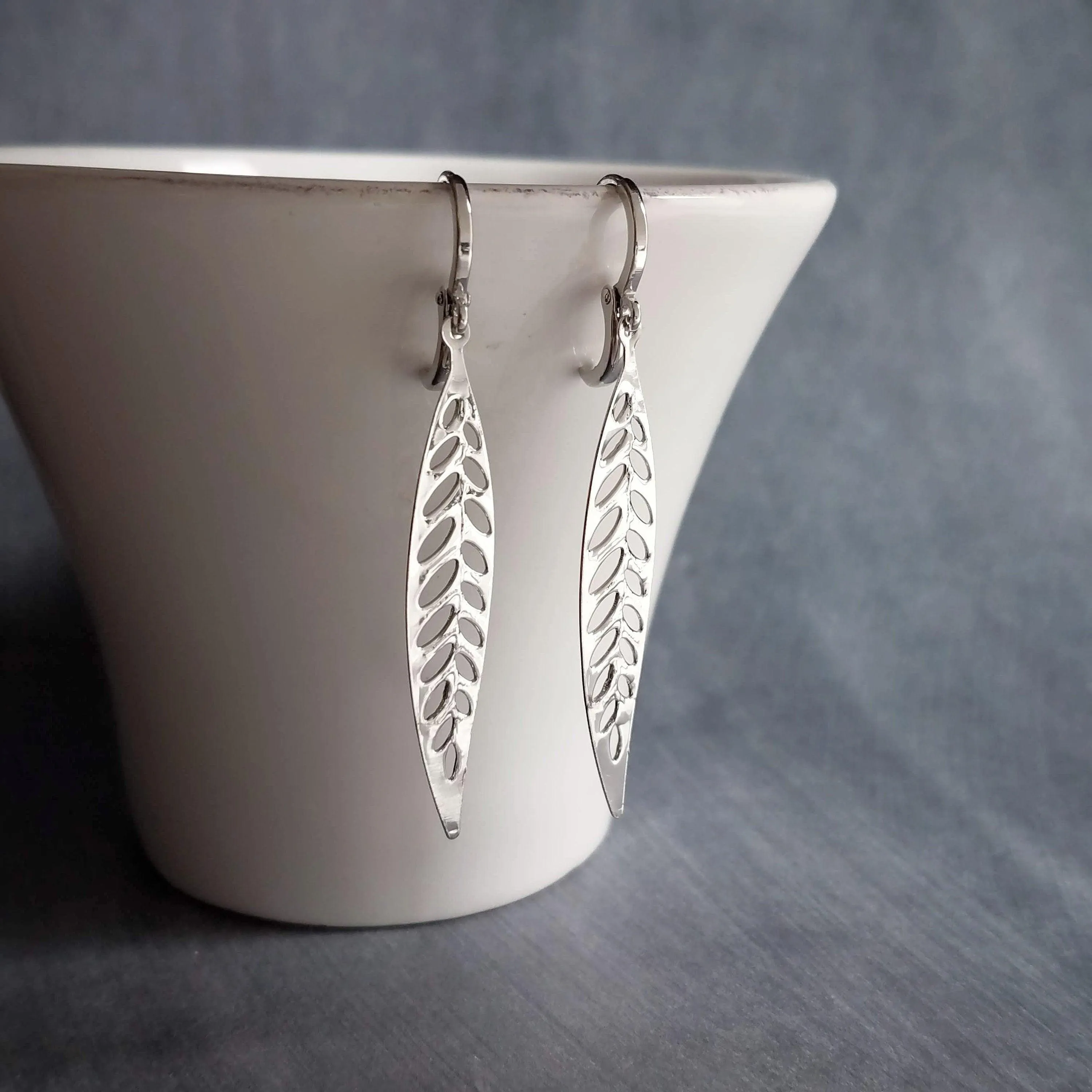 Thin Silver Leaf Earrings, long narrow leaf earrings, filigree leaves earring, long silver leaf earring, cut out leaf earring, huggie hoops
